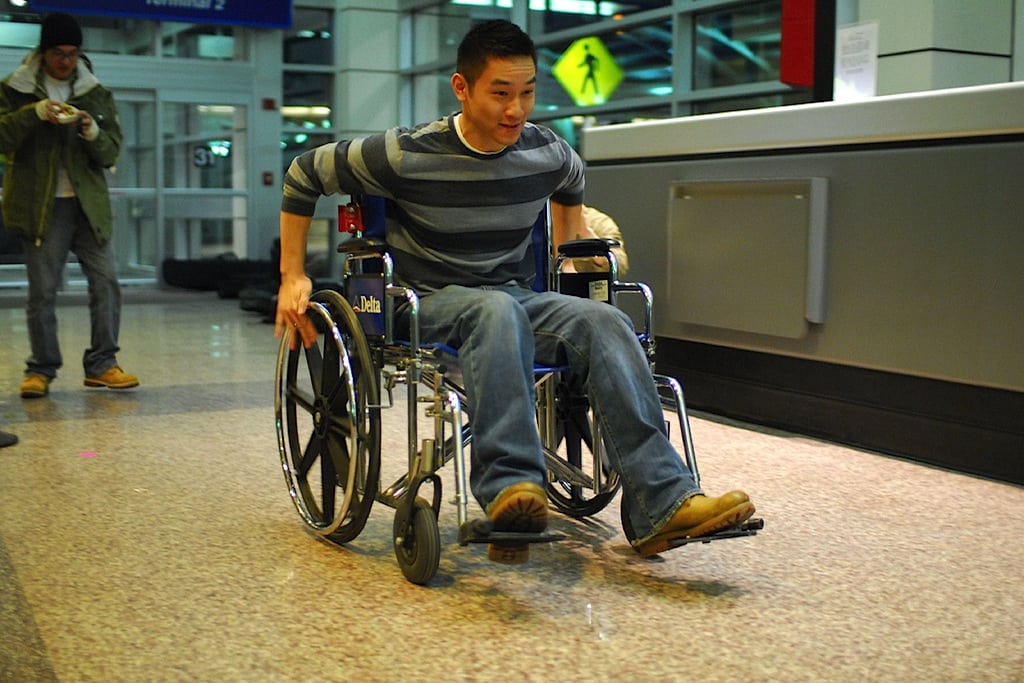 Boys race through Salt Lake City Airport in wheelchairs provided by Delta Air Lines. 
