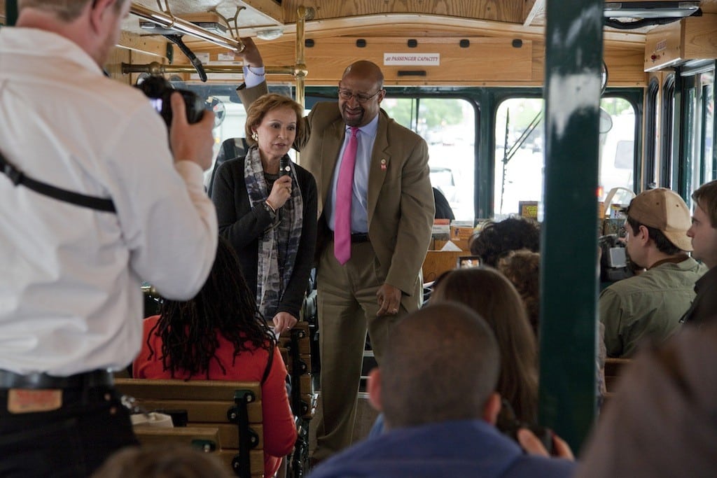 Meryl Levitz, president and CEO of Visit Philadelphia, speaks to media on a Philadelphia Neighborhoods trolley tour in April 2013. To her left is Philadelphia Mayor Michael Nutter.