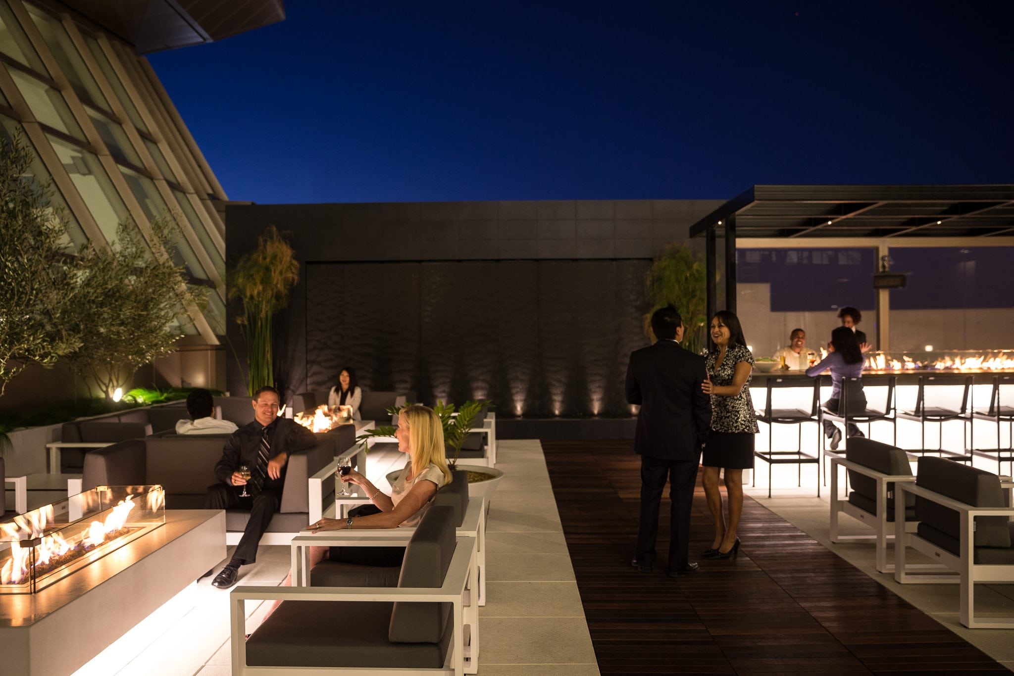 Passengers relax in the Air New Zealand LAX lounge and bar on the roof terrace. 