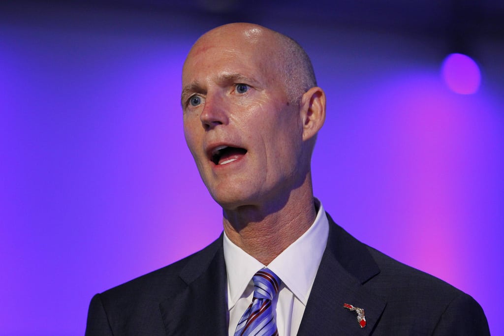 Florida Republican Gov. Rick Scott speaks at a ceremony opening new newsroom facilities for the Univision and Fusion television networks in Doral, Florida August 28, 2013.