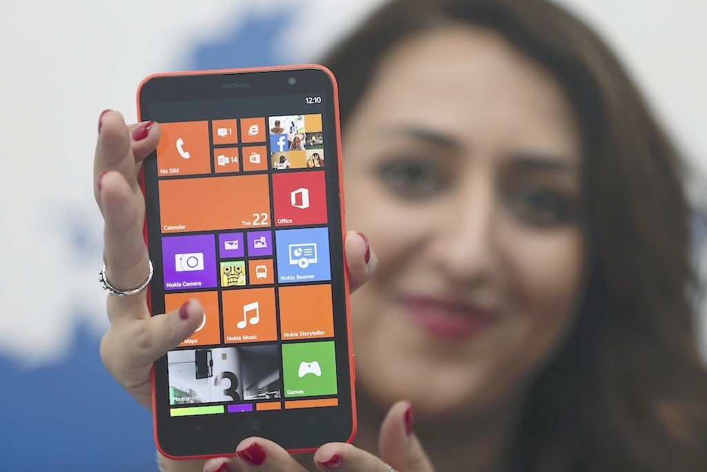 A model displays the Lumia 1320 smartphone during its launch in Abu Dhabi October 22, 2013. 
