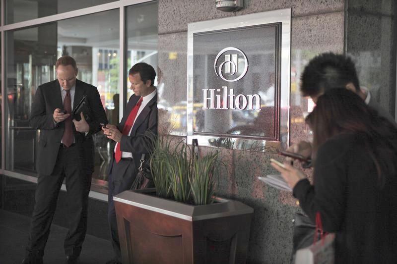 Is the traveler a Hilton guy or an Aloft woman? Traxo is serving up personalized hotel recommendations. Pictured, guests wait outside at the Hilton, New York's largest hotel, on Sixth Avenue June 13, 2012. 