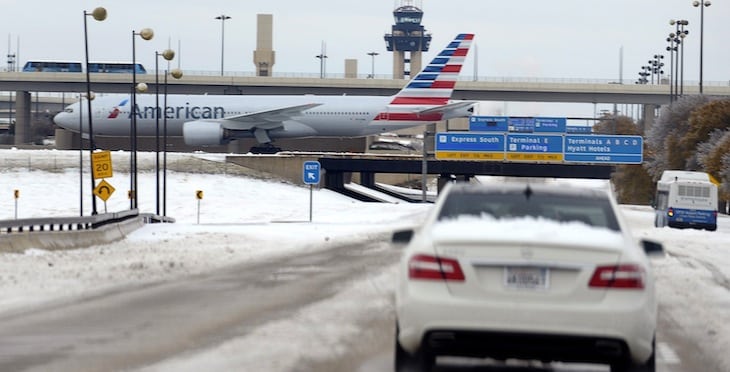 By a narrow margin, just 2,292 votes, American Airlines employees voted in favor of the new flag tail design that was unveiled last year. Pictured, an American Airlines jet crosses International Parkway as motorist slowly travel at Dallas/Fort Worth International Airport, Friday, Dec. 6, 2013. 