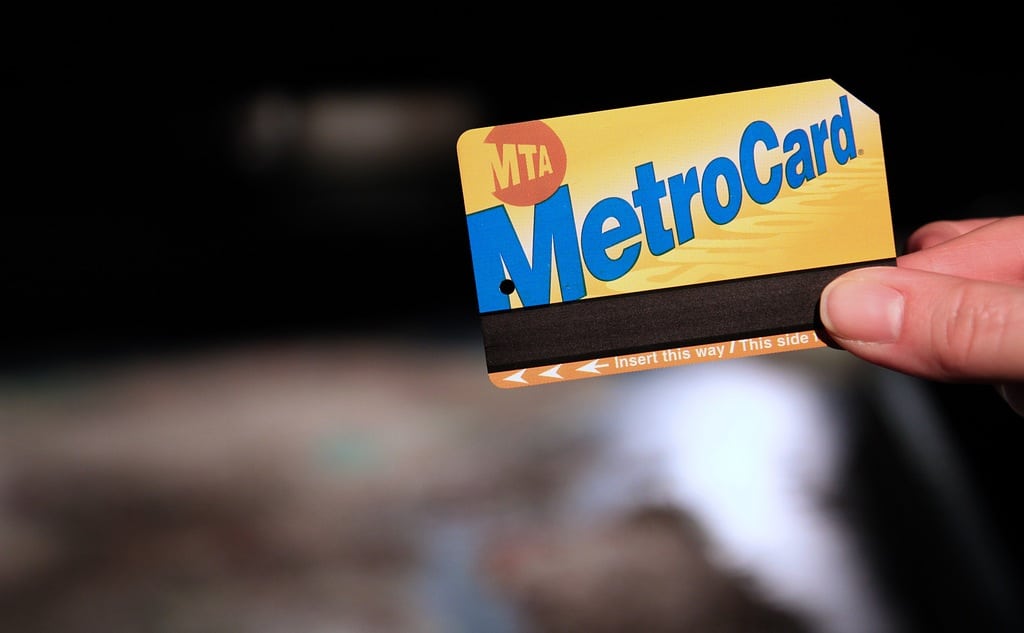 MTA Metrocard, with the Panorama of New York City in the Queens Museum of Art in the background.