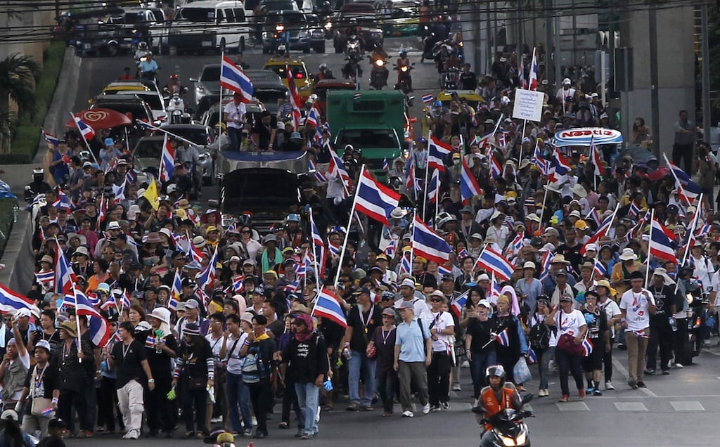 Anti-government protesters march towards Thailand's Industry Ministry in Bangkok November 27, 2013. 