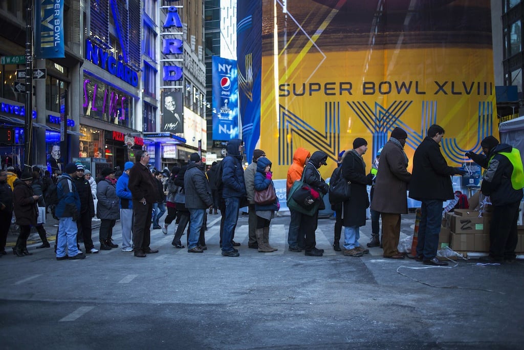 People line up for accessories on Broadway as preparations continue for Super Bowl XLVIII in New York January 29, 2014. 