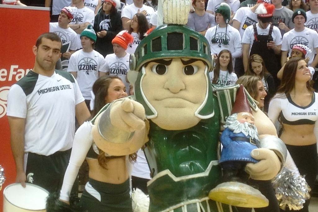 The Michigan State University mascot holds the Roaming Gnome at  Saturday game on January 25, 2014. 
