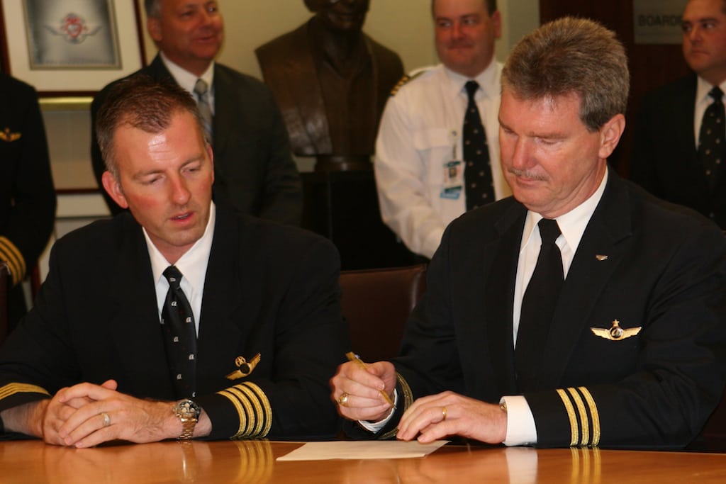 The FAA has made sweeping changes to the way pilots work, revamping rest requirements. Pictured, pilots from the Southwest Airline Pilots Association and Airline Pilots Asspociation gather to sign a seniority integration agreement, November 8, 2011.
