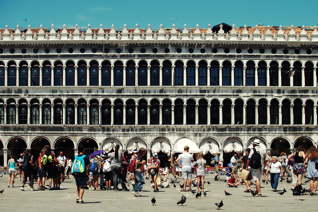 Piazza San Marco in Venice, Italy, filled with tourists.