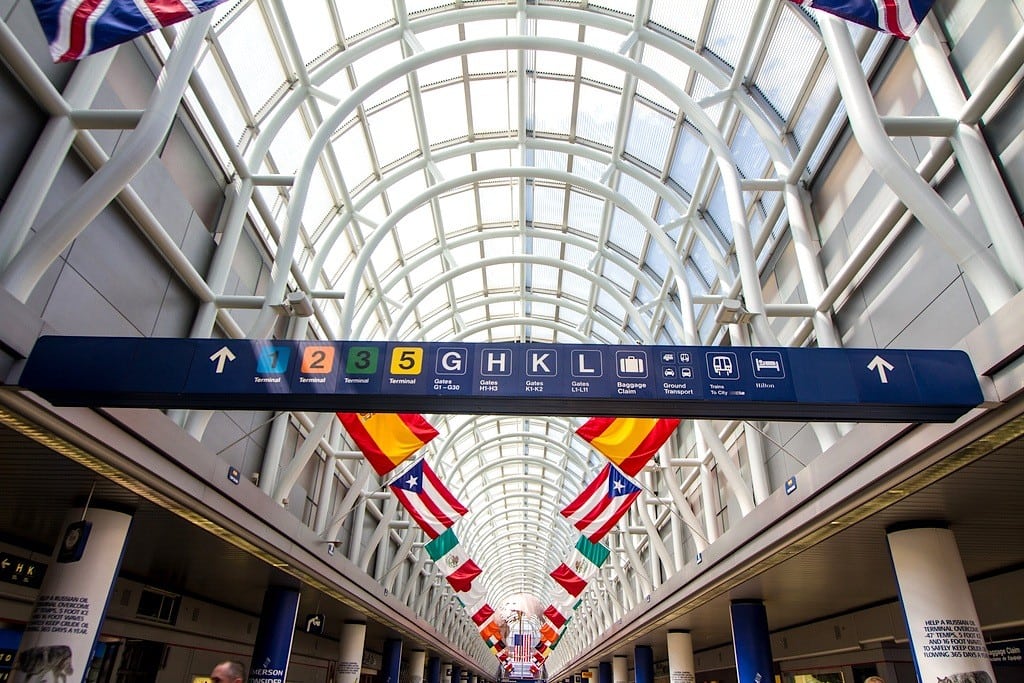 Flags hang in a terminal at Chicago's O'Hare International Airport.