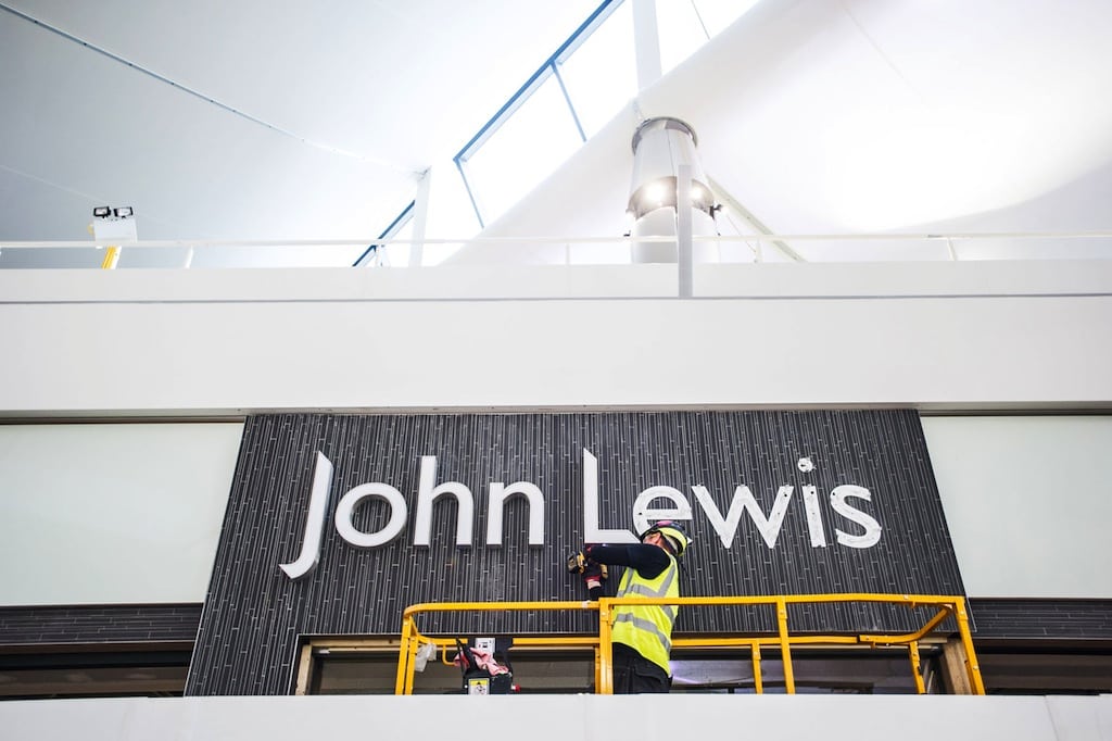 The sign for a John Lewis retail outlet is installed inside Heathrow Airport's Terminal 2 on December 5, 2013. 