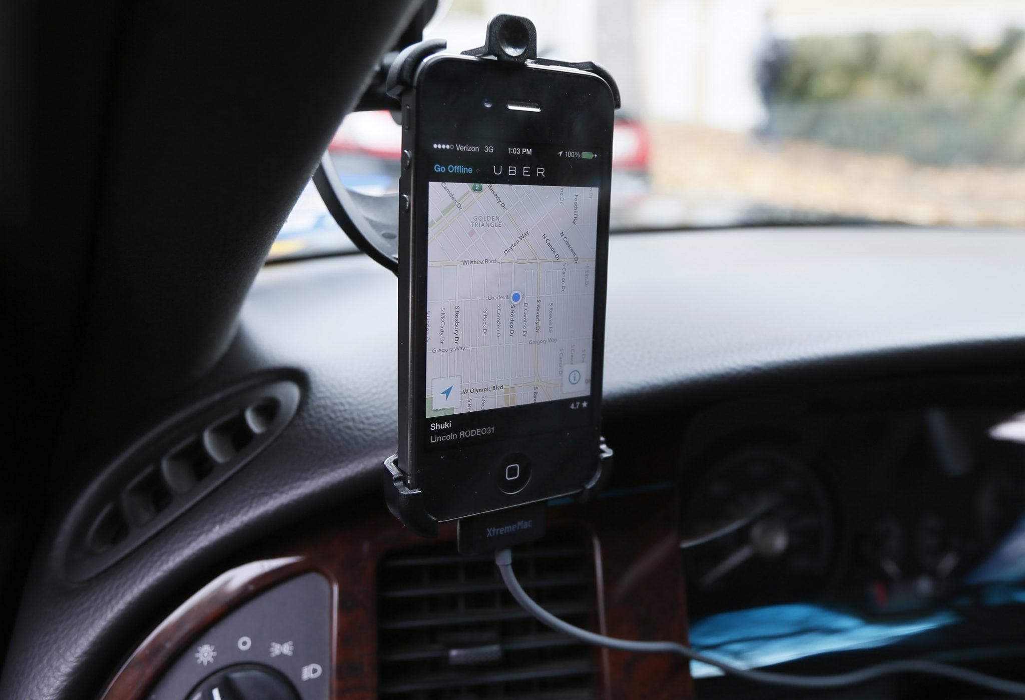 Transportation app Uber is seen on the iPhone of limousine driver in Beverly Hills, California.