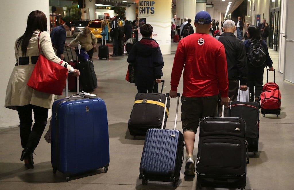 Passengers walking through Los Angeles International Airport.