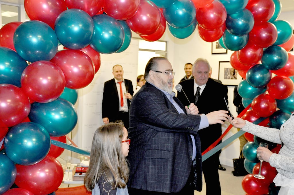 Travel Leaders CEO Barry Liben cutting the ribbon March 27, 2014, at the travel management company's new UK facilities.
