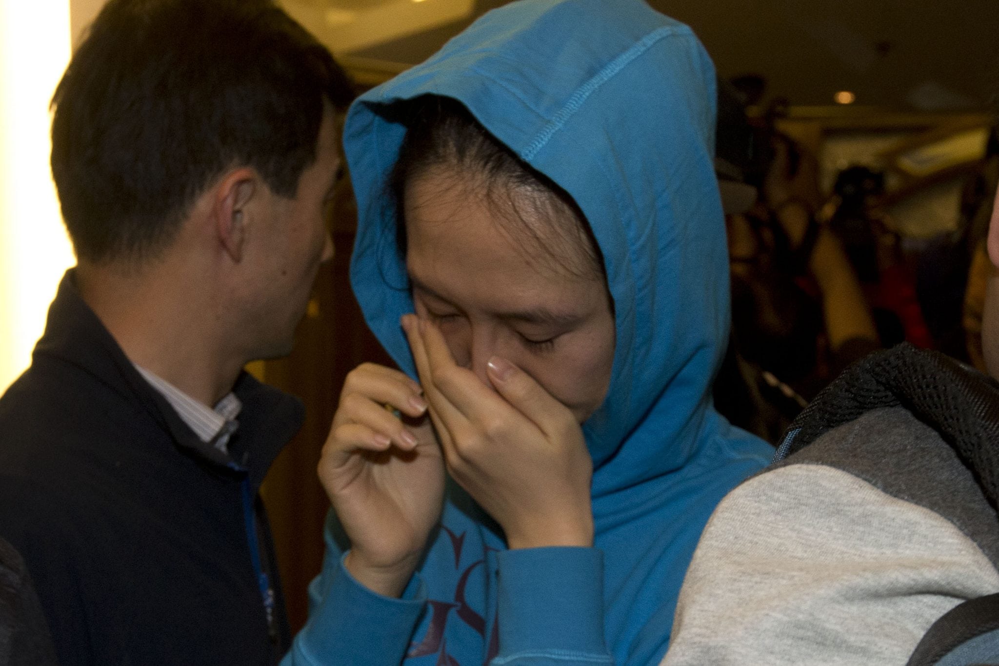 A relative of a Chinese passenger aboard the Malaysia Airlines MH370, cries after being told the latest update in Beijing, China, Monday, March 24, 2014. 