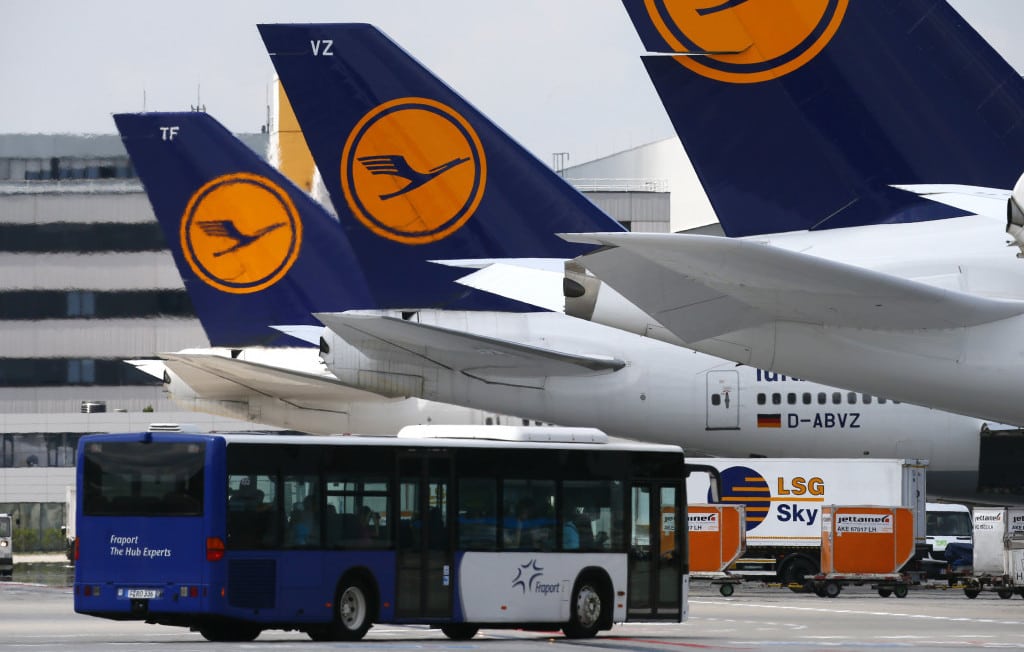 Lufthansa aircrafts sit on the tarmac at Frankfurt airport. 