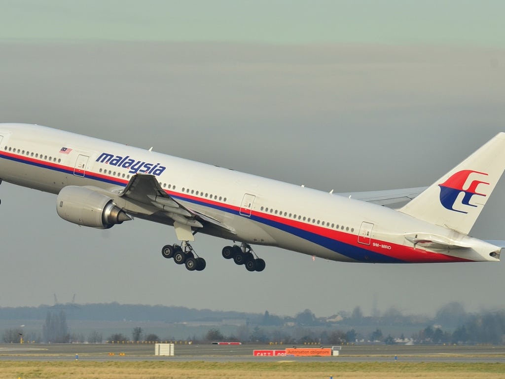 This photo provided by Laurent Errera and taken Dec. 26, 2011, shows a Malaysia Airlines Boeing 777-200ER taking off from Roissy-Charles de Gaulle Airport in France. This is the same aircraft that disappeared from air traffic control screens on March 8, 2014, and hasn't been found.