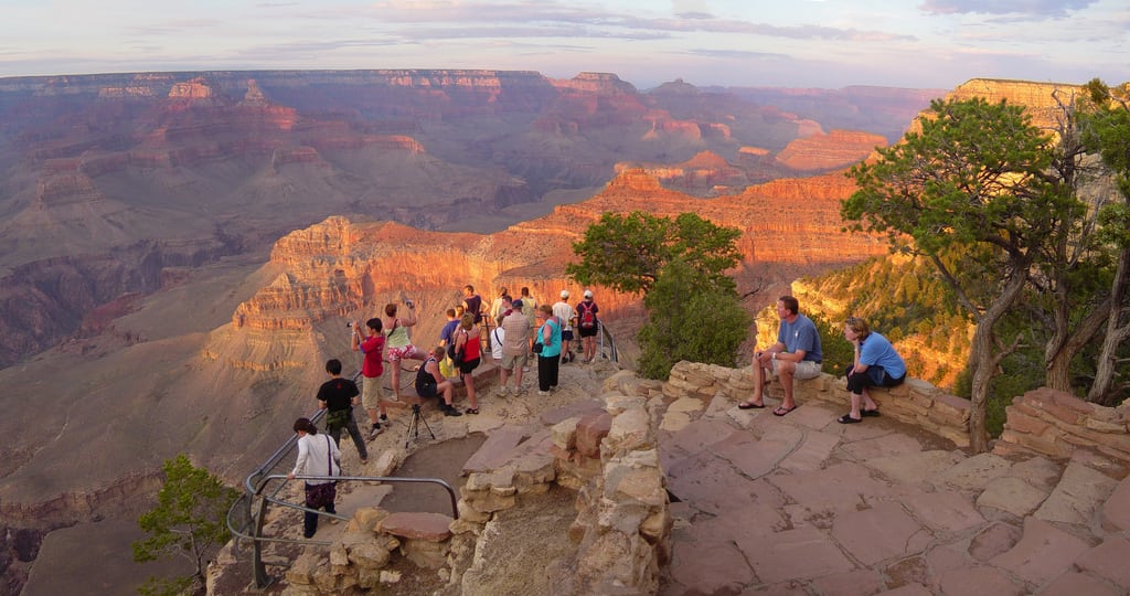 Tourists look out from the Yavapai Observation Station on the South Rim of the Grand Canyon.