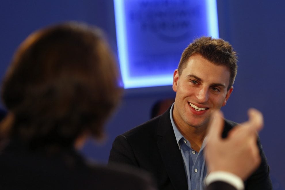 Brian Chesky, Chief Executive Officer of Airbnb smiles during a session at the annual meeting of the World Economic Forum (WEF) in Davos. His company has lost two political battles in two weeks in two of its most important markets. 
