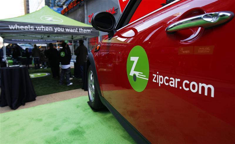Zipcar just posted its most profitable quarter in its history. Pictured, the Zipcar.com logo is seen on a Mini Cooper car during a promotional event in New York's Times Square April 14, 2011. 