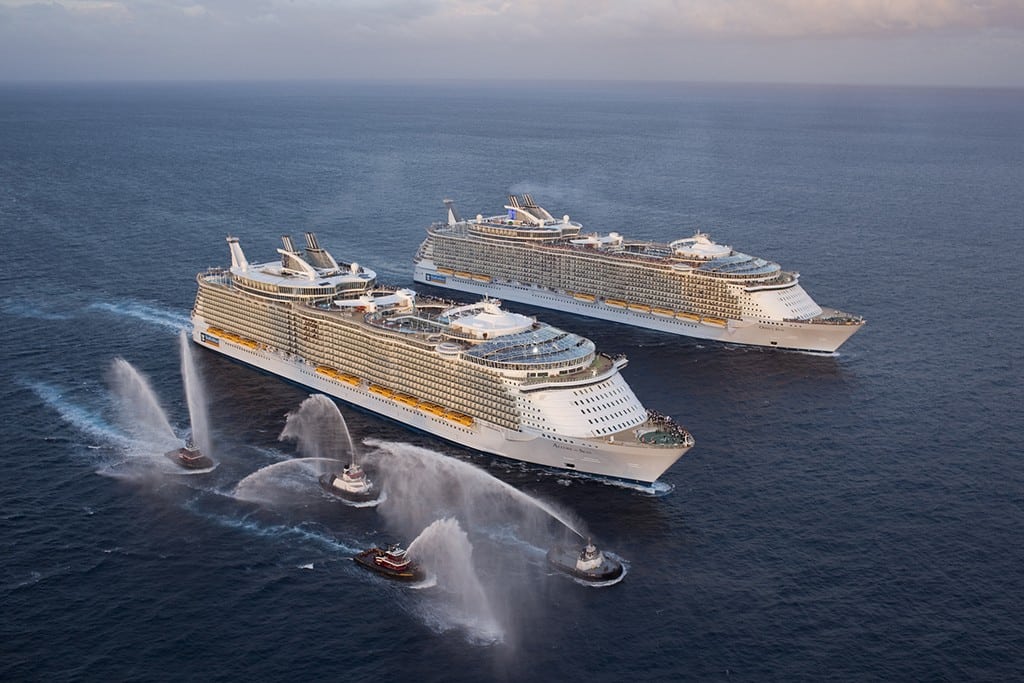 The giant Allure of the Seas meets sister Oasis of the Seas off Port Everglades.
