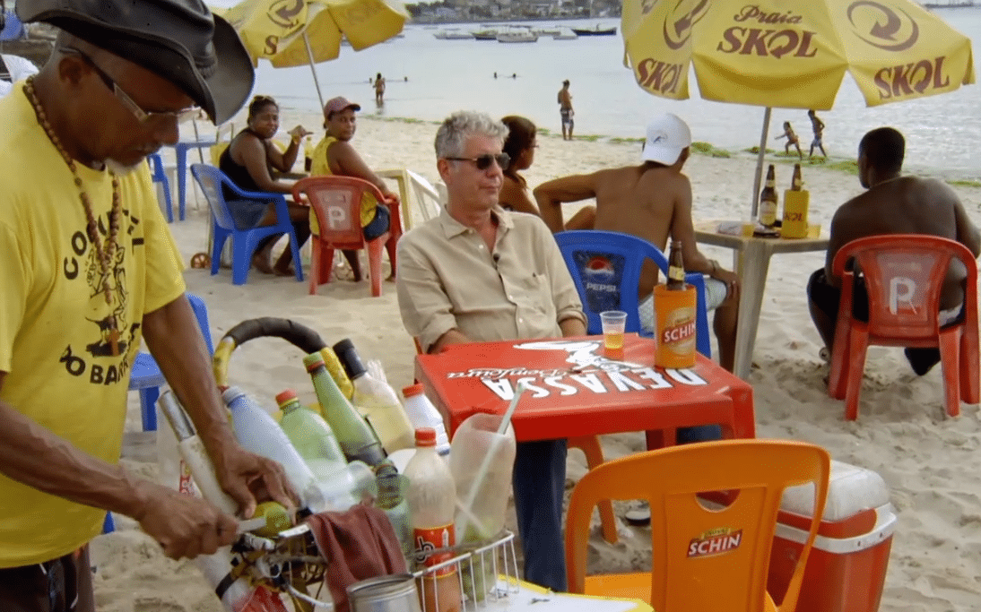 Anthony Bourdain orders a caipirinha on the beach in Brazil.