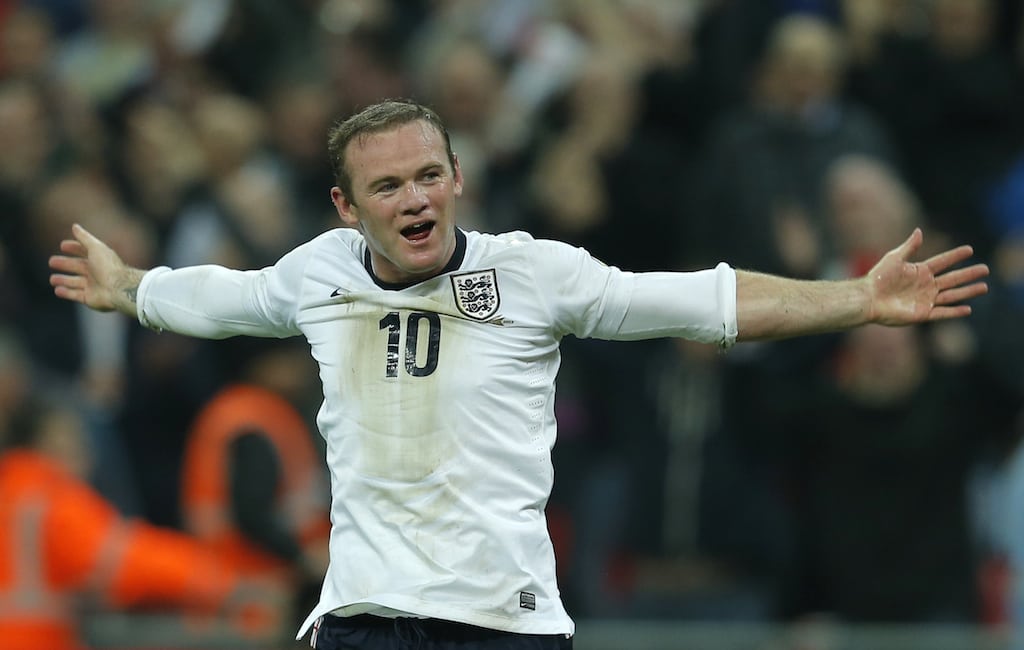 England's Wayne Rooney celebrates after scoring during their 2014 World Cup qualifying soccer match against Poland at Wembley Stadium in London October 15, 2013.