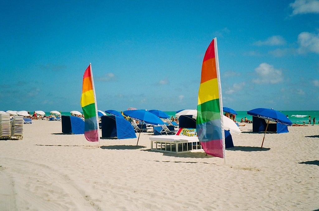 Rainbow flags line the beach in Miami, Florida.