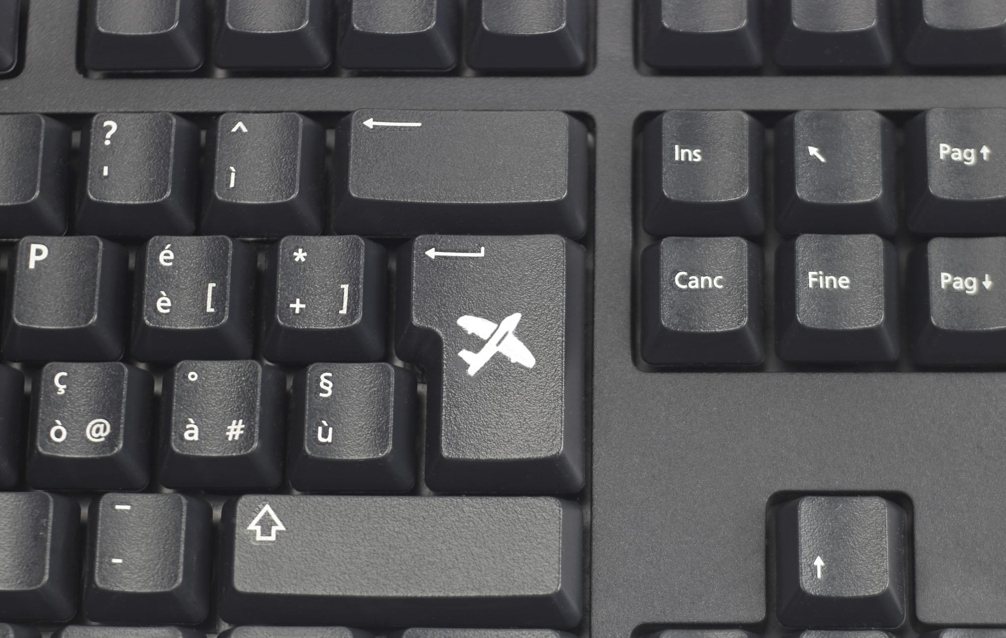 A plane superimposed over a keyboard.