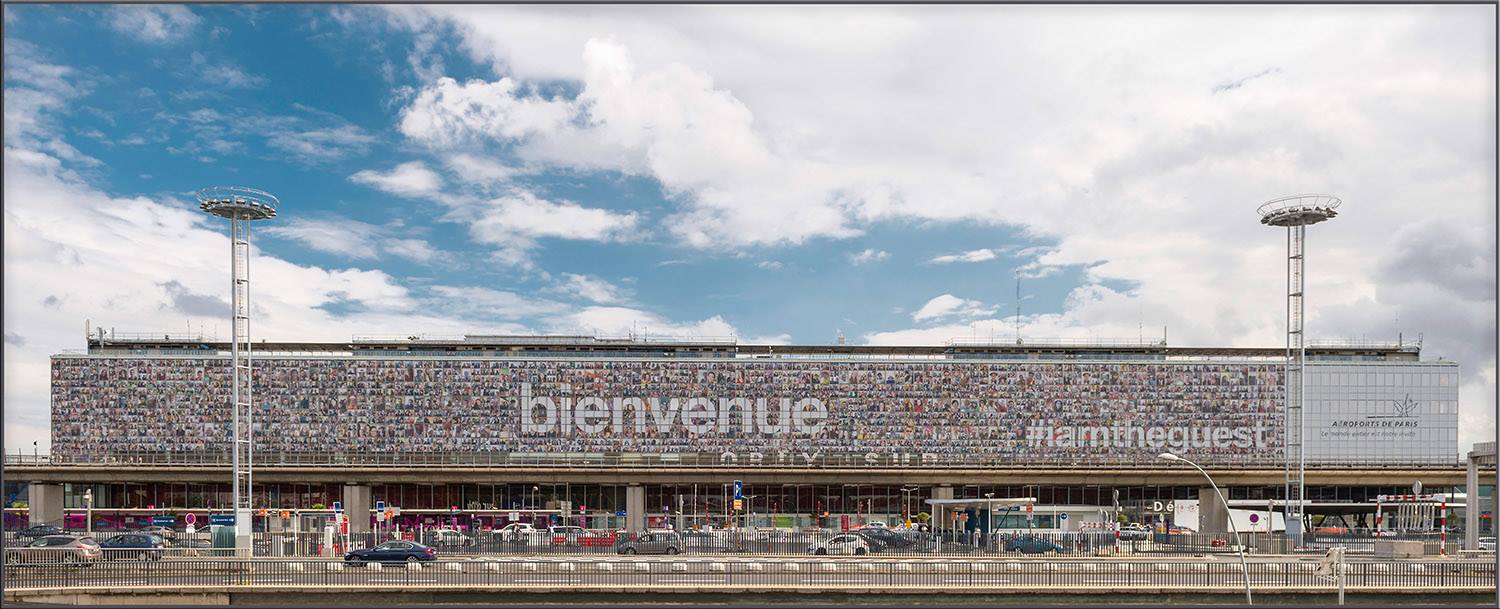 Selfies #iamtheguest mosaic at Paris-Orly Airport.