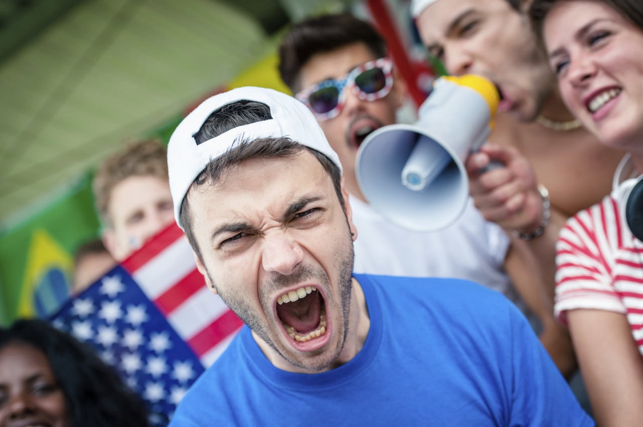 An American soccer fan screams at a FIFA World Cup stadium.