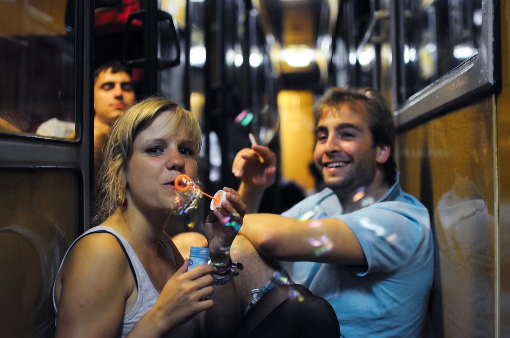 Backpackers onboard a night train in Eastern Europe. 