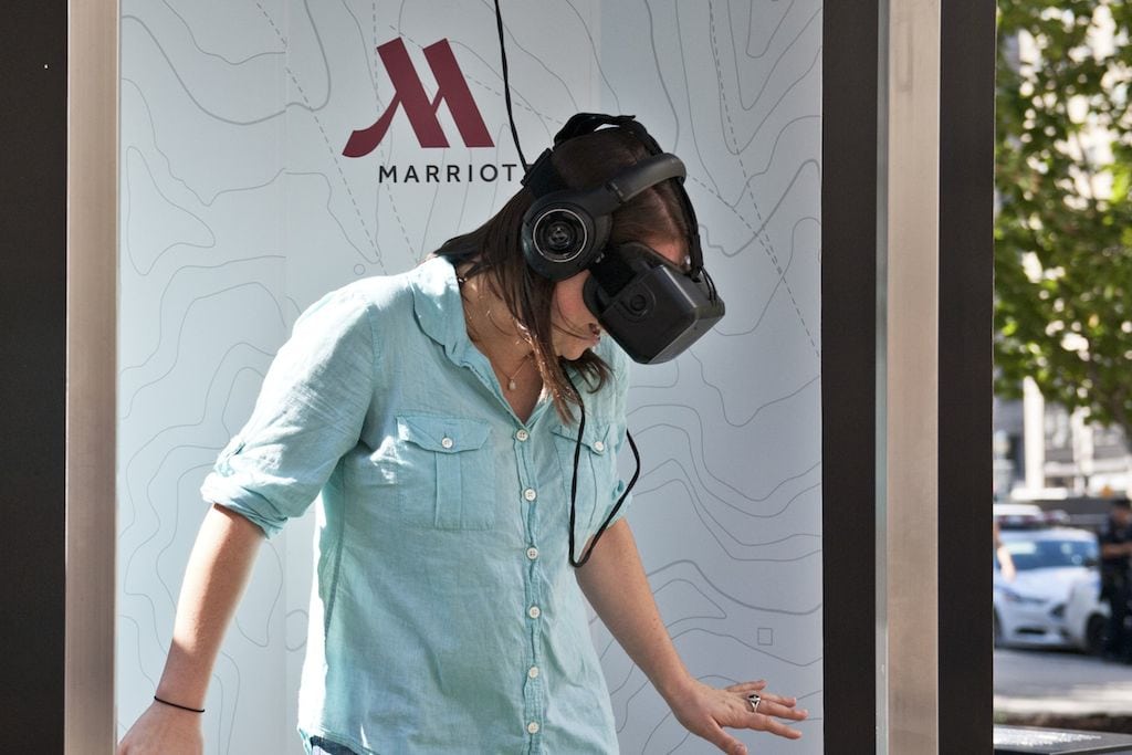 Teleporter tester tries out Oculus Rift virtual reality headset in a demo by Marriott hotels. 