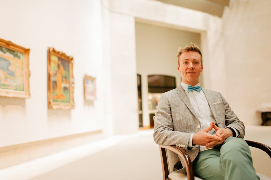 Nick Gray, founder of Museum Hack, sits in the Metropolitan Museum of Art.