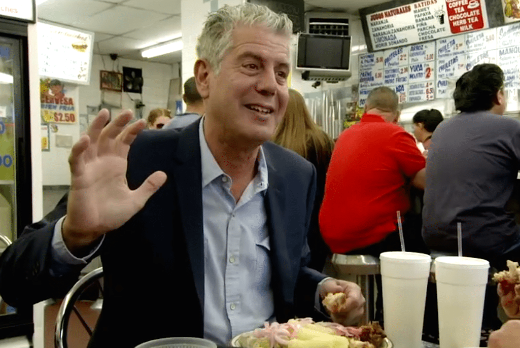 Anthony Bourdain snacks at a Puerto Rican restaurant in the Bronx. 