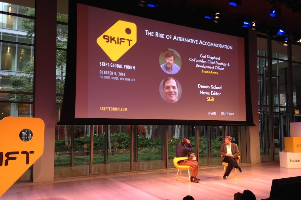 Carl Shepherd (right) and moderator Dennis Schaal speaking at Skift Global Forum in New York City on Oct. 9, 2014.