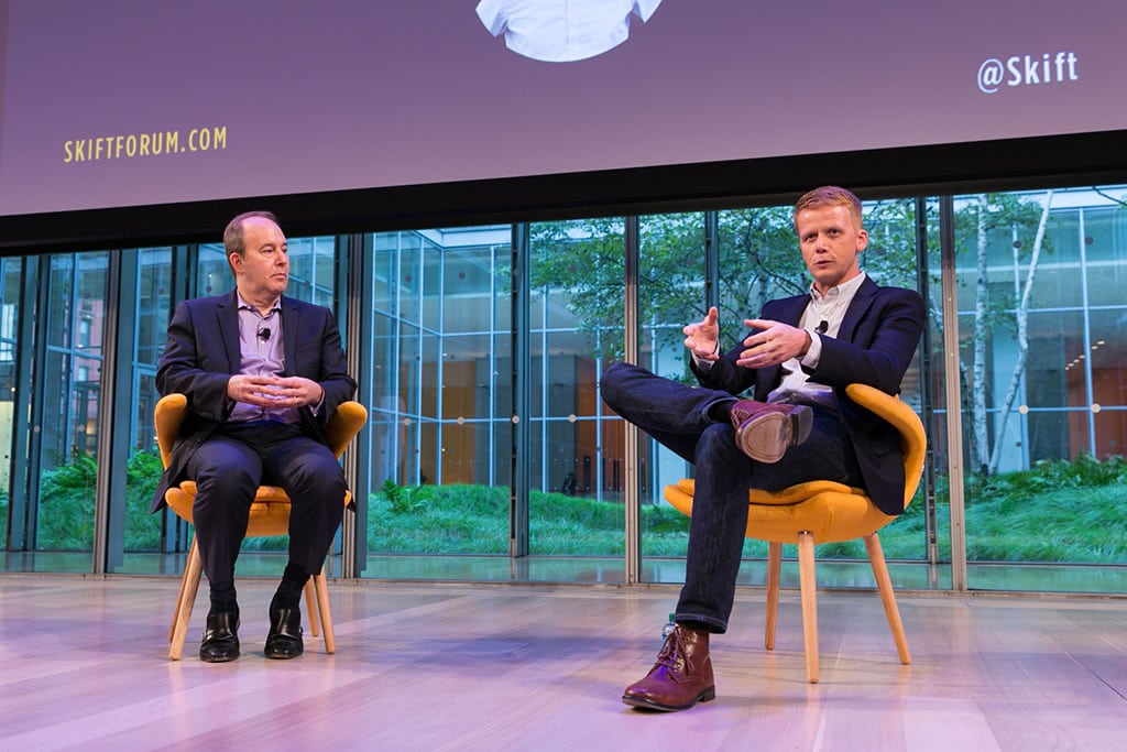Henry Harteveldt of Atmosphere Research (L) interviewing Ben Orson, Managing Director, JPA Design (R), at the Skift Global Forum in New York City on October 9, 2014. 