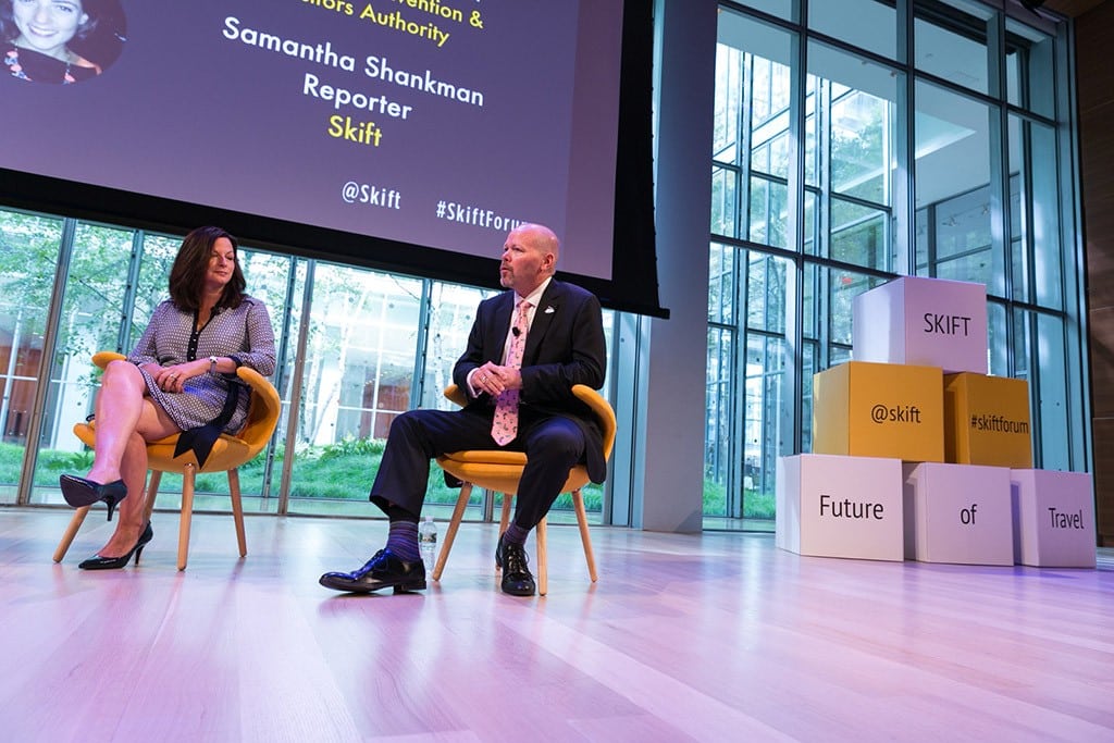 Will Seccombe, CEO of VisitFlorida (R) speaking at the Skift Global Forum in New York City on October 9, 2014. Seccombe reportedly agreed to resign his post today following a request by the state's governor. 