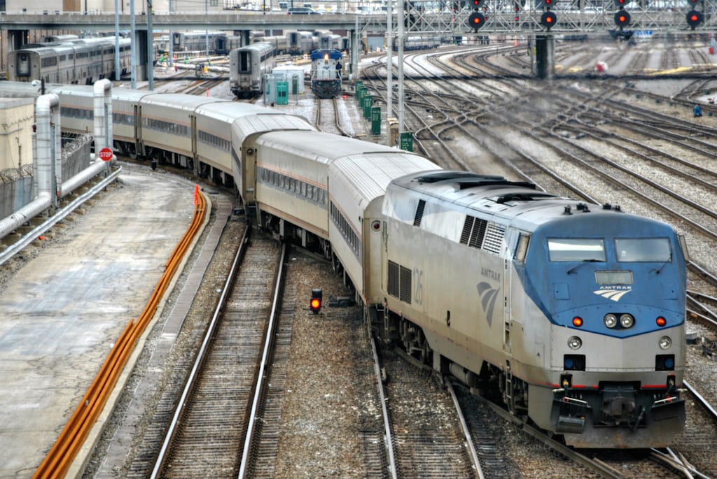 An Amtrak train moves out of the 14th Street Coach Yard at Chicago Union Station.