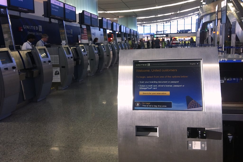 United Airlines' self-service check-in kiosks at Boston Logan Airport. 
