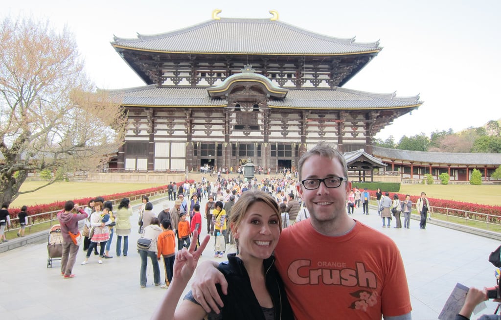 Detail of a photo of two tourists at a temple in Nara, Japan.