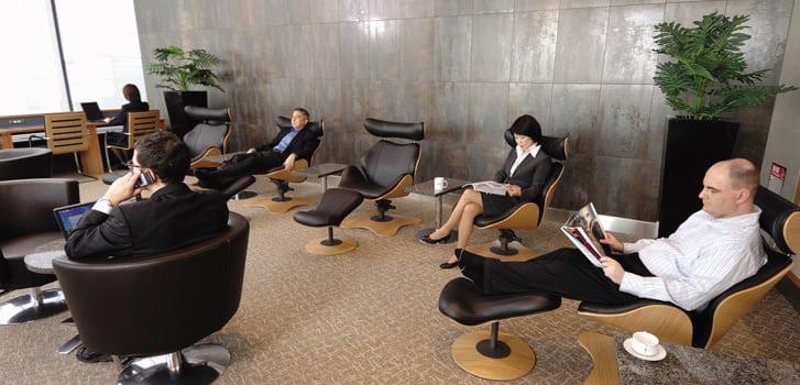 Passengers in the "Relax" area of American Airlines Admirals Club. 