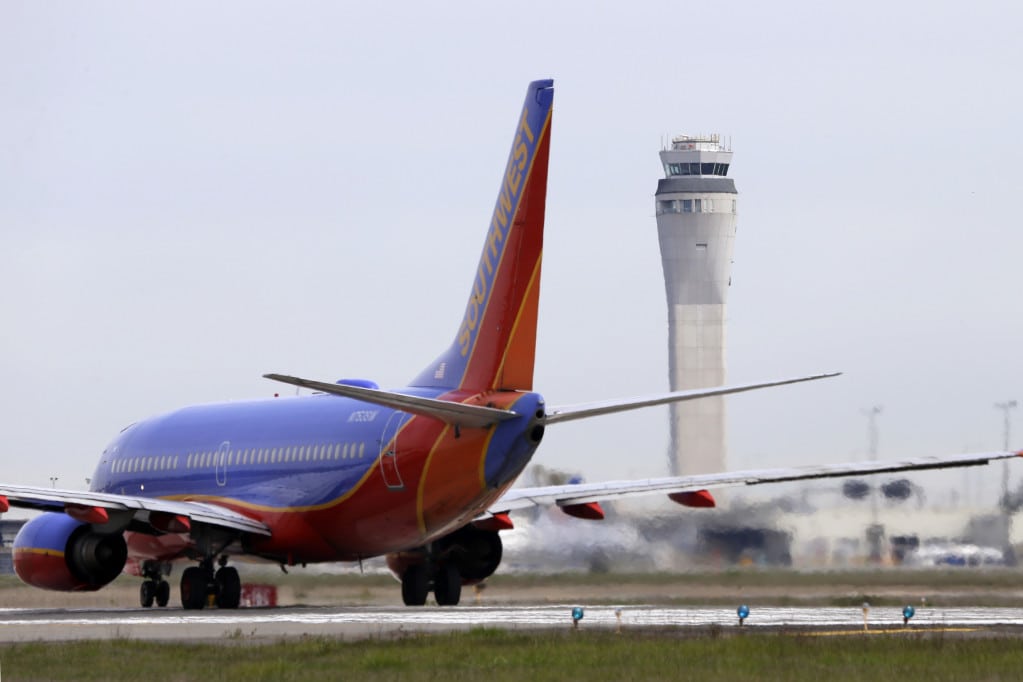 This photo taken April 23, 2013 shows a Southwest airlines jet waiting to depart in view of the air traffic control tower at Seattle-Tacoma International Airport in Seattle. 