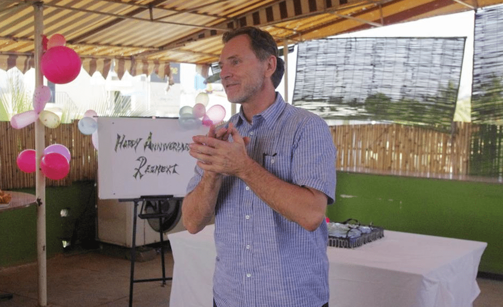RezNext Global Solutions CEO Mike Kistner addresses the team at an anniversary celebration on July 30, 2014.
