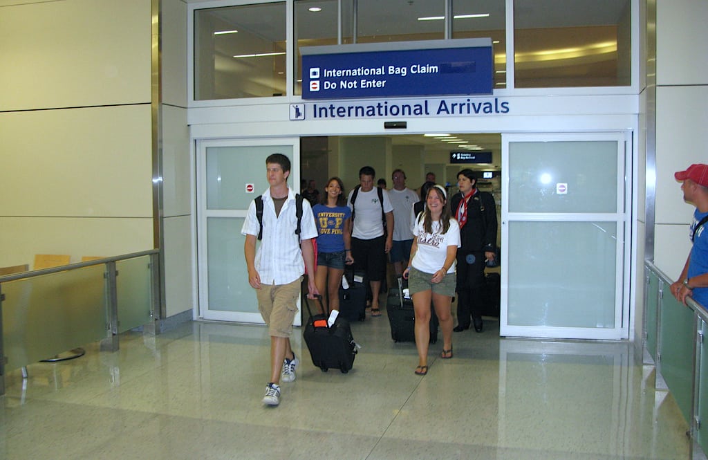 Passengers arrive from overseas at Dallas-Fort Worth Airport. 