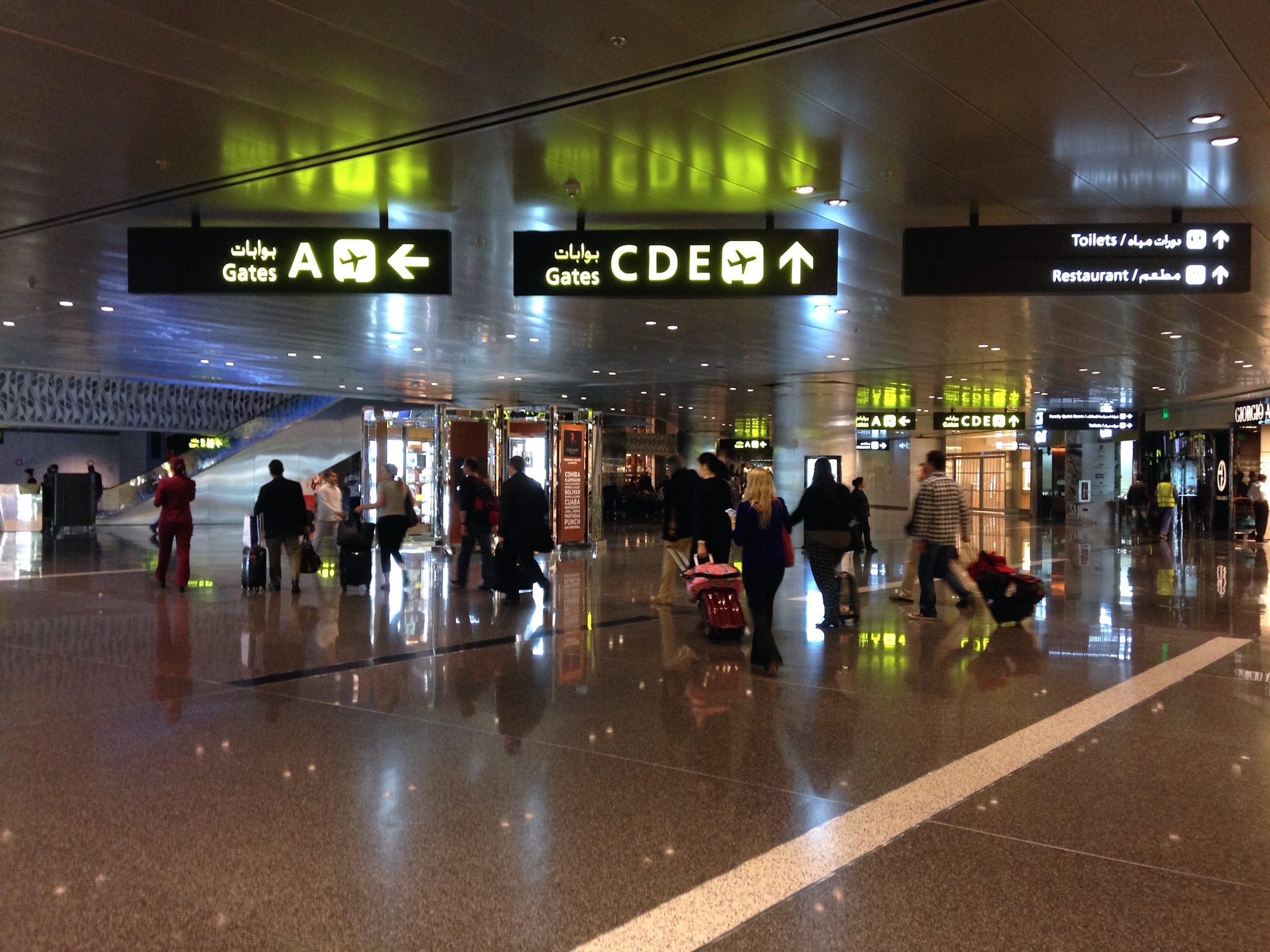Passengers walk through Hamad International Airport in Doha, Qatar.