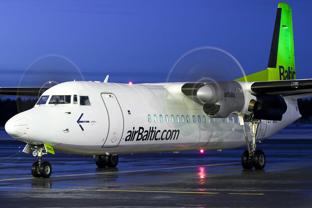 An airBaltic F50 aircraft on the tarmac at Oulu Airport in Finland.
