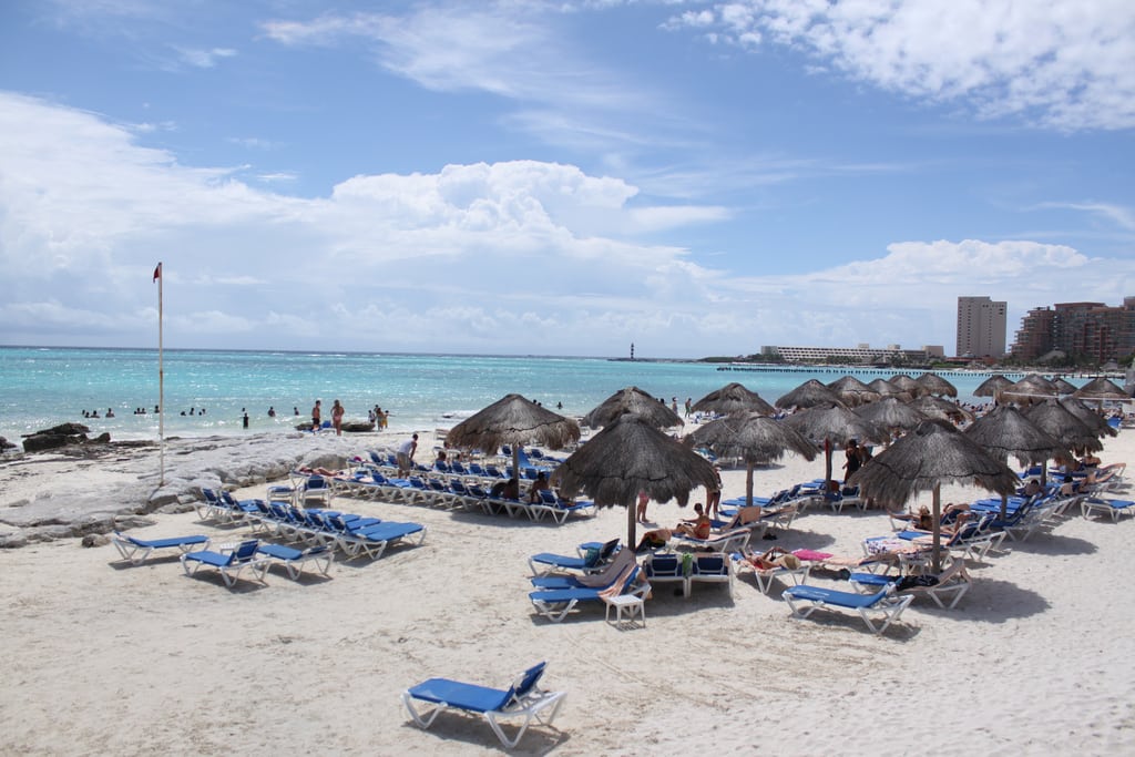 Lounge chairs line the beach in Cancun, Mexico. 
