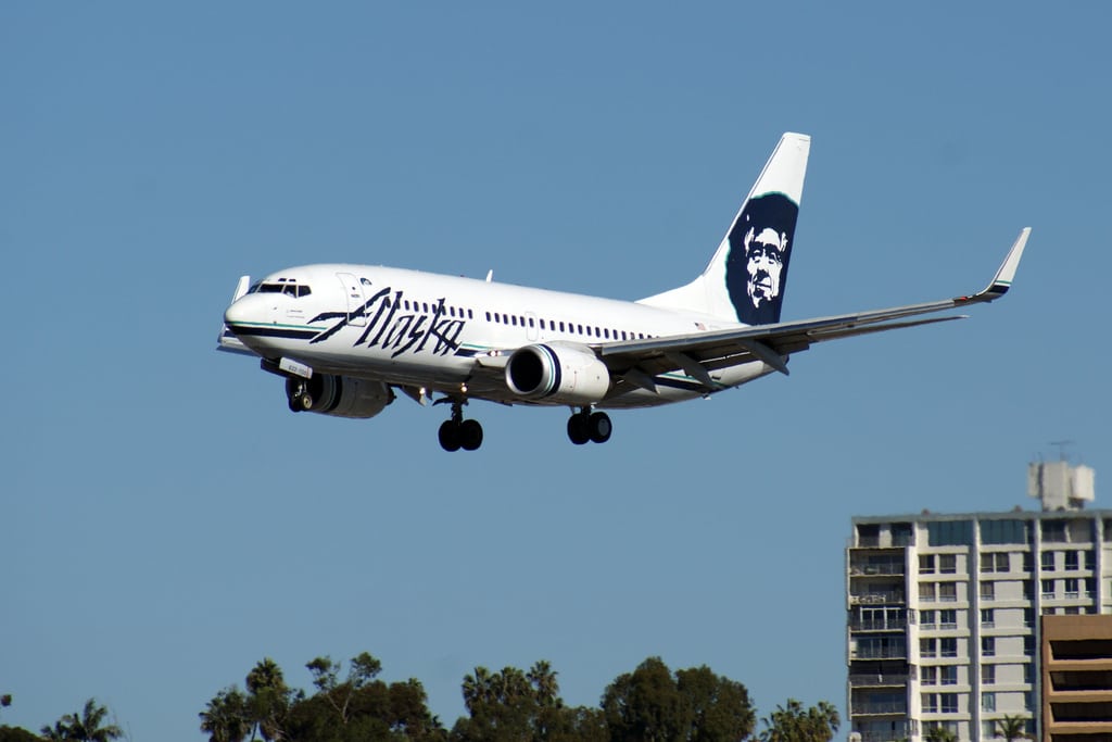 An Alaska Airlines plane painted like a salmon. 