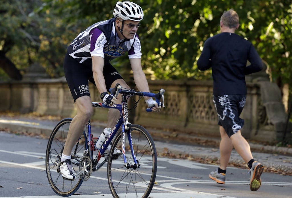Starwood Hotels CEO Frits van Paasschen rides his bicycle in New York's Central Park, Tuesday, Oct. 8, 2013.